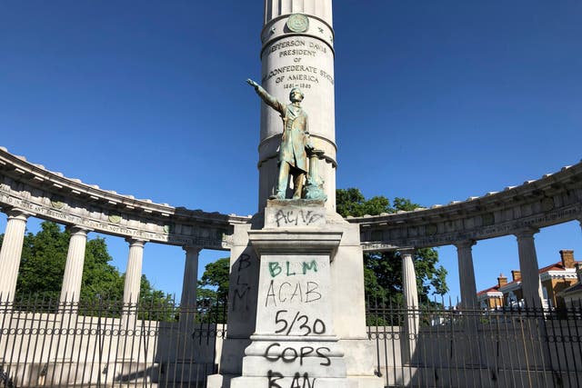 A monument to Confederate President Jefferson Davis in Richmond, Virginia is covered with graffiti