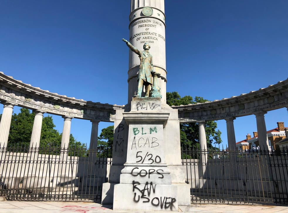 A monument to Confederate President Jefferson Davis in Richmond, Virginia is covered with graffiti