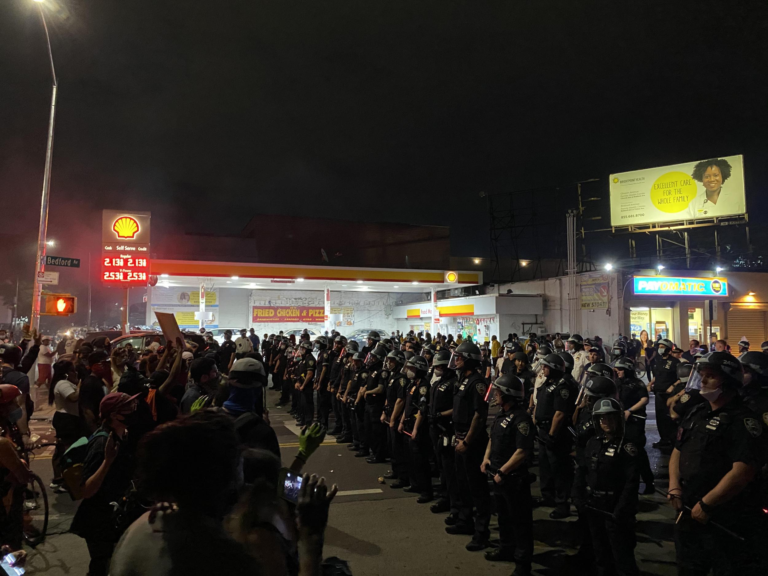 Protesters face off with police in Flatbush, Brooklyn, on Saturday, May 30. (Richard Hall / The Independent )