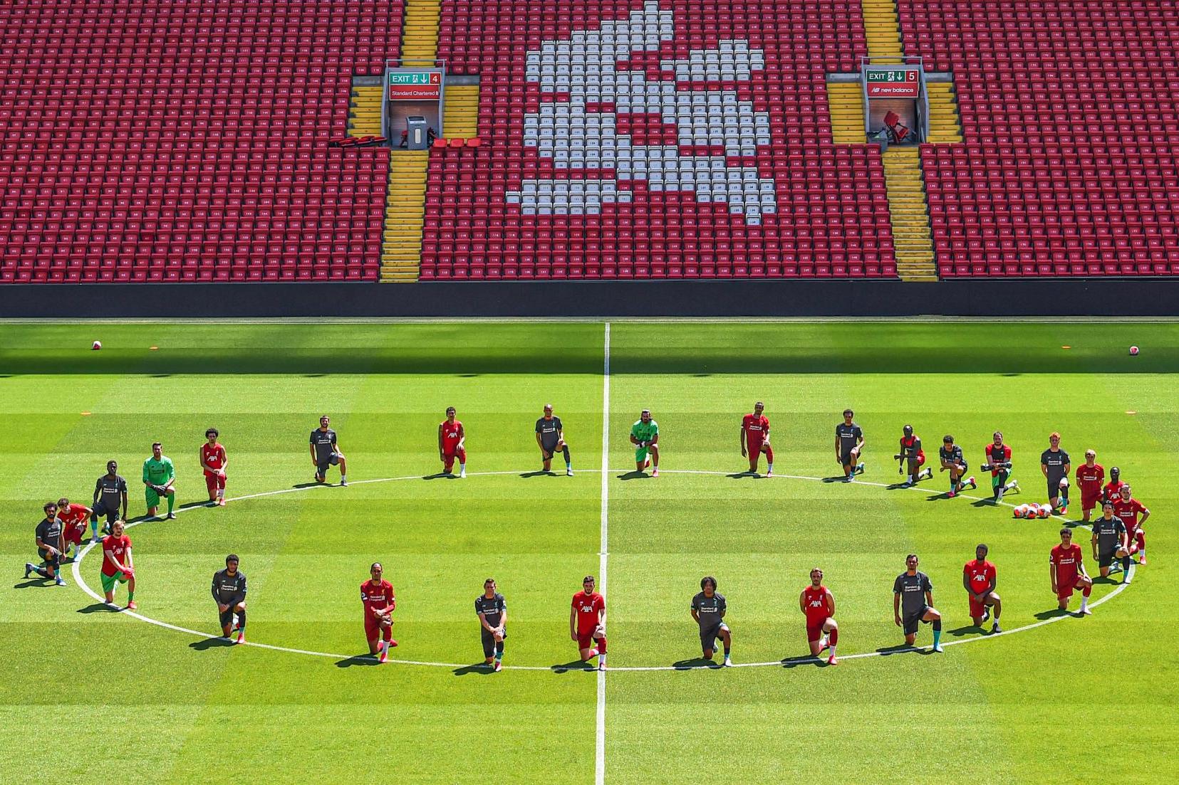 Liverpool’s players take a knee