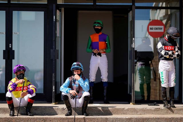 Jockeys observing social distancing at Newcastle Racecourse