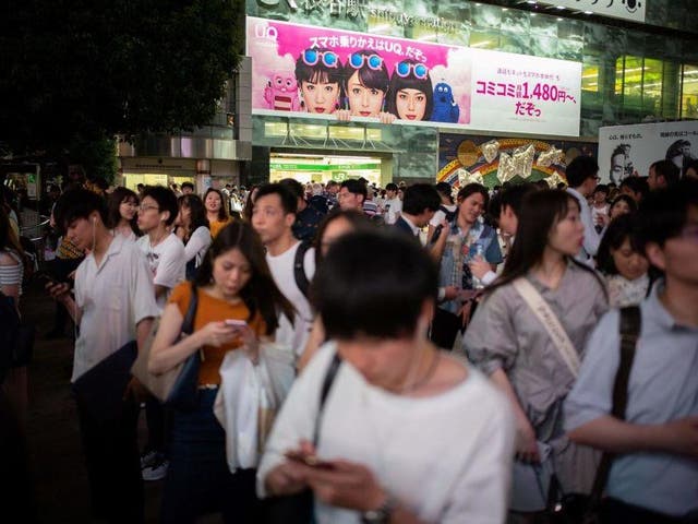 Officials in Japan say increased mobile phone use while walking is causing a rise in accidents