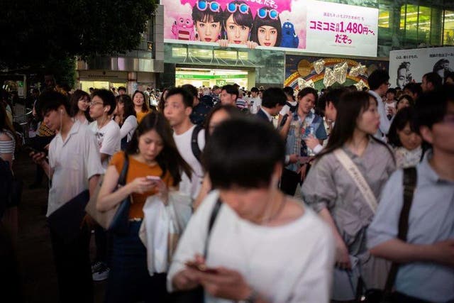 Officials in Japan say increased mobile phone use while walking is causing a rise in accidents