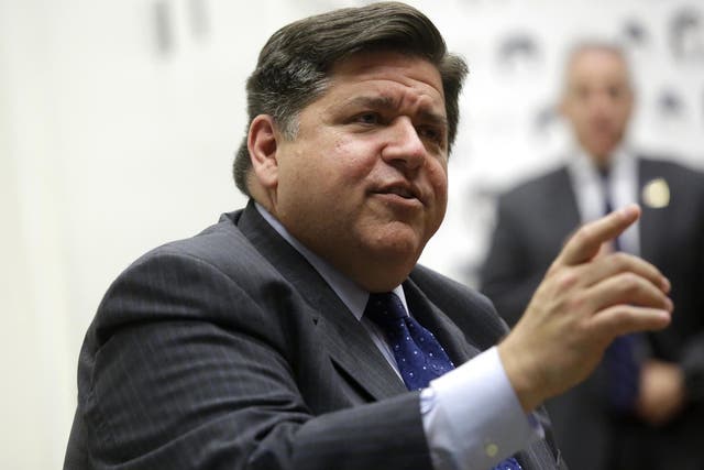 JB Pritzker speaks during a round table discussion with high school students at a creative workspace for women