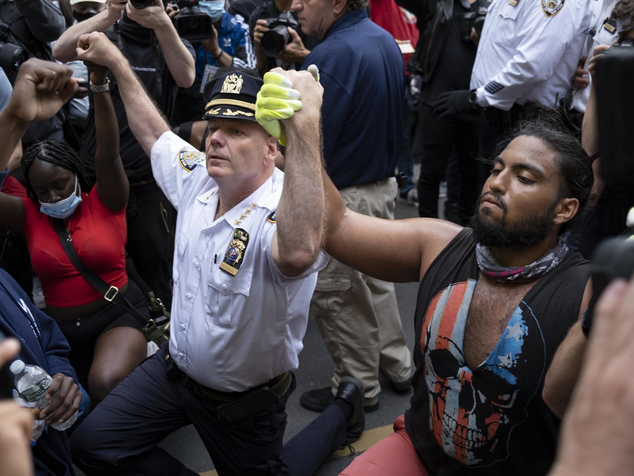New York protests: NYPD chief kneels with demonstrators and calls for end to violence