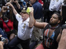 NYPD chief kneels with demonstrators and calls for end to riots