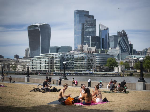 People enjoy the sun at Potters Field, London, on 2 June, 2020.