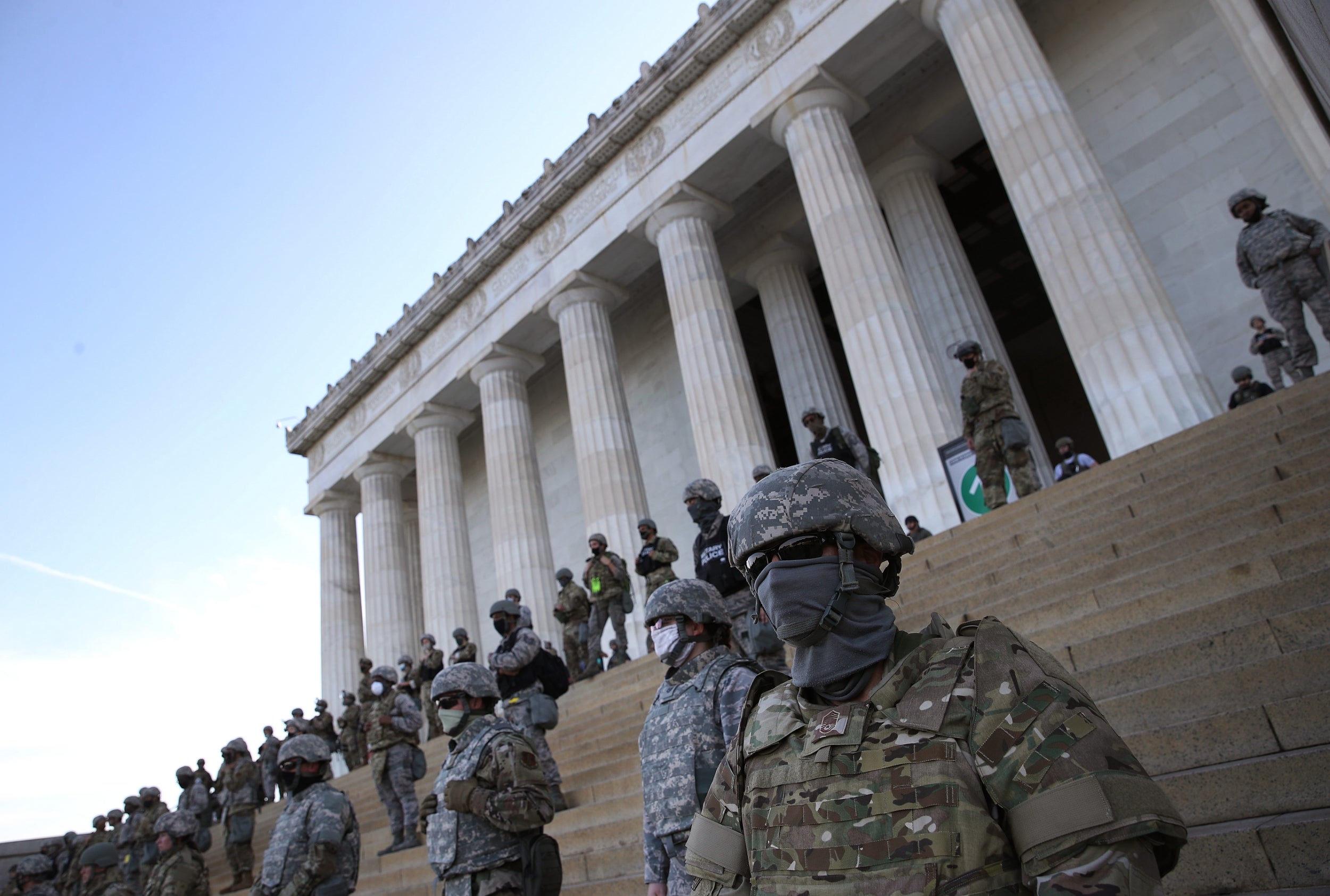 Members of the DC National Guard assemble on the steps of the Lincoln Memorial as protesters demonstrate peacefully against police brutality