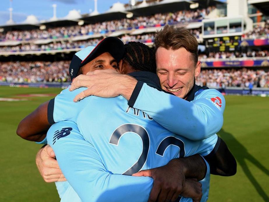 Jos Buttler, Adil Rashid and Archer embrace after England's World Cup final win in 2019