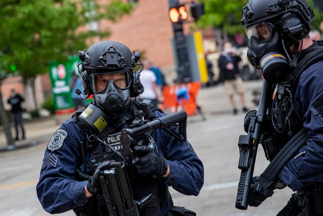 Police prepare to fire non-lethal projectiles just after curfew in Grand Rapids