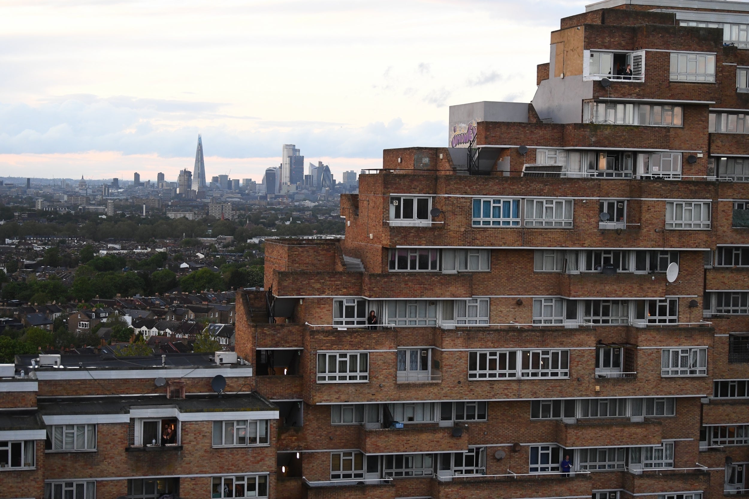 Residents of Dawson’s Heights flats in south London join the Clap for Carers to recognise and support health workers on the front line of the pandemic