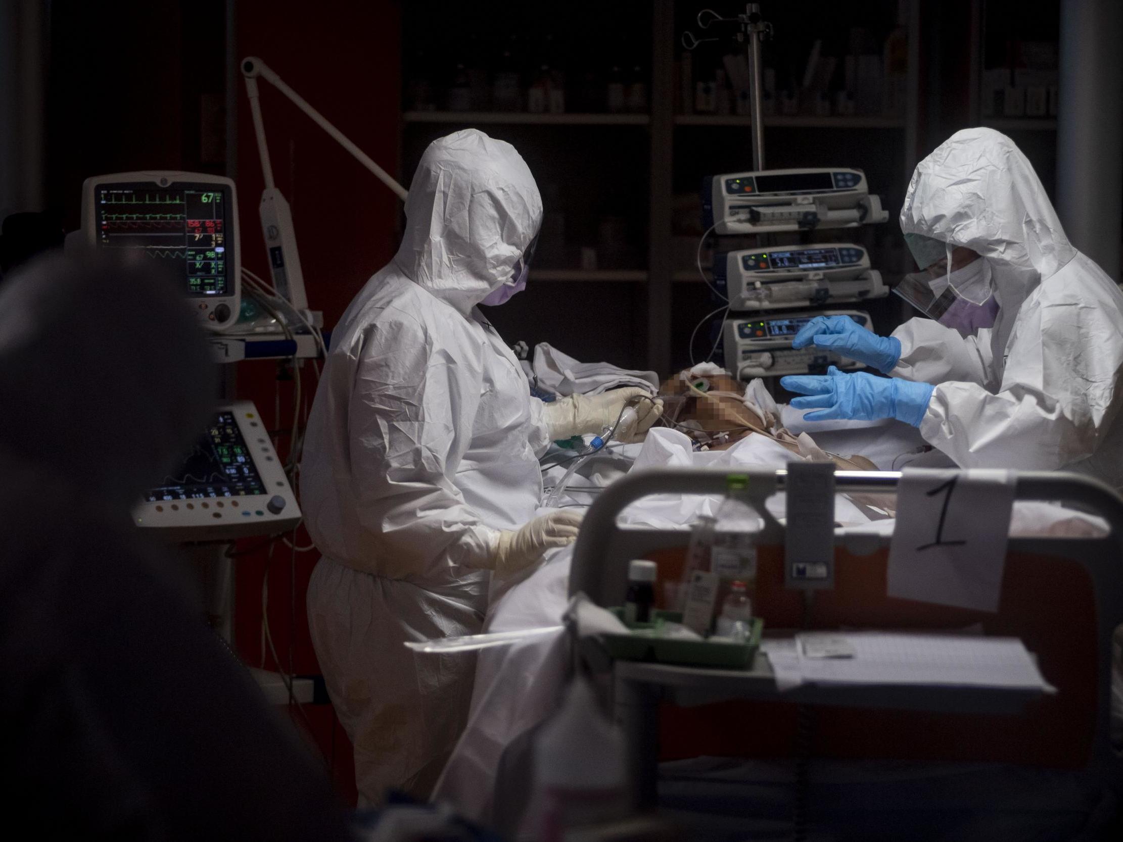 A patient is treated in an intensive care unit at a hospital in Rome