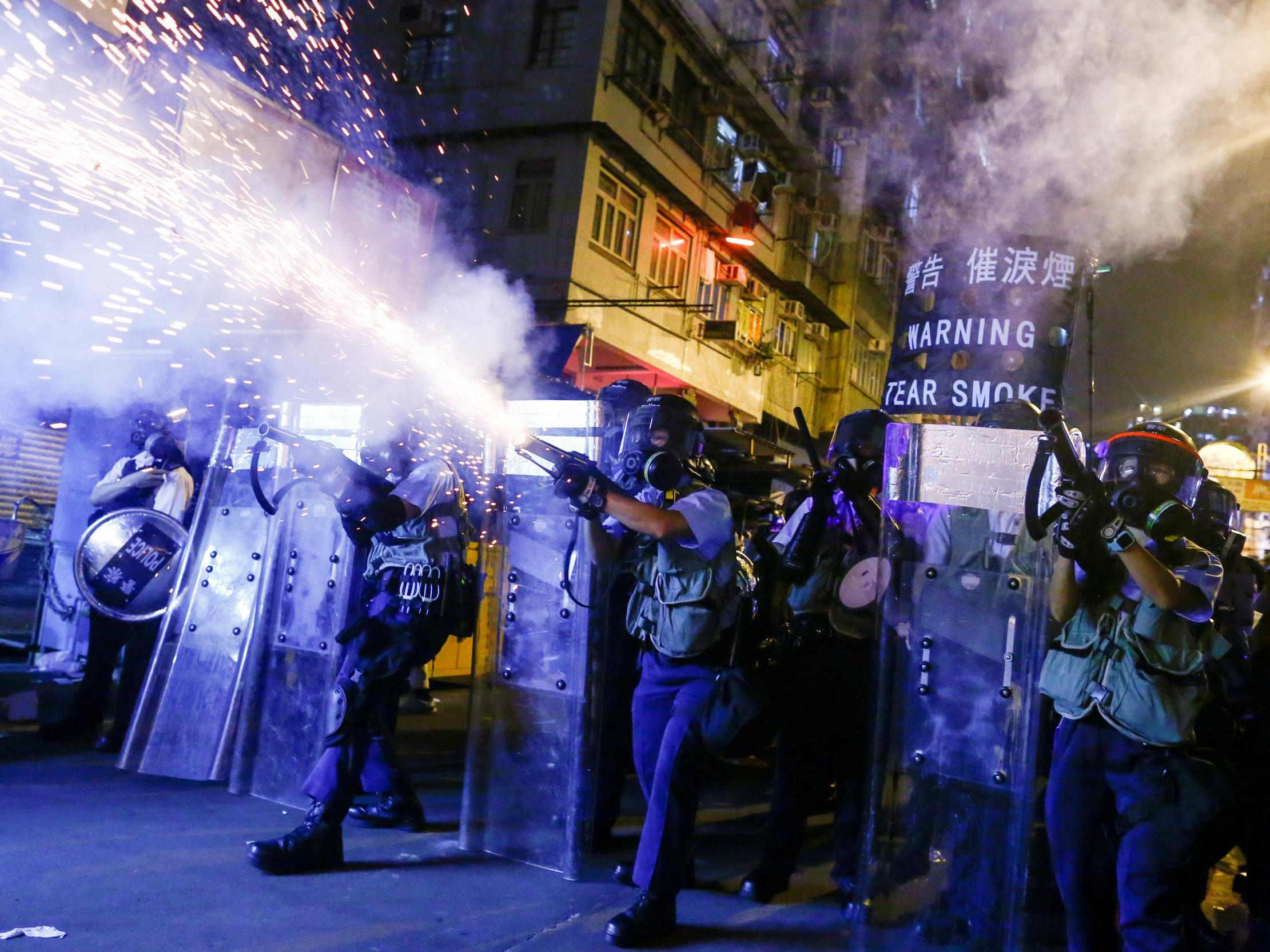 Police fire tear gas at anti-extradition bill protesters during clashes in Sham Shui Po in Hong Kong, 14 August, 2019