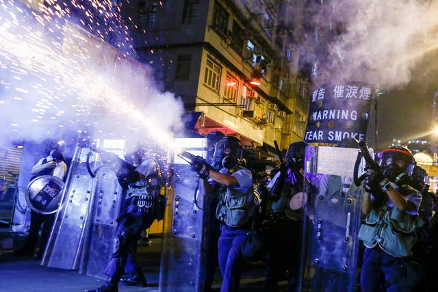 Police fire tear gas at anti-extradition bill protesters during clashes in Sham Shui Po in Hong Kong, 14 August, 2019