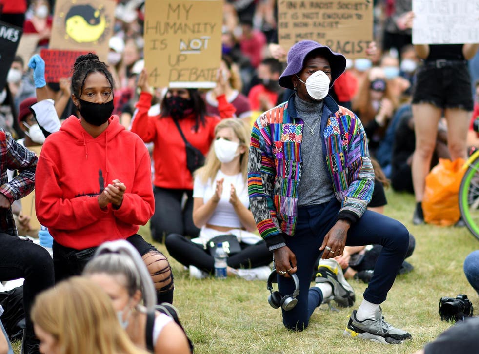 A protester kneels during a Black Lives Matter protest on 3 June 2020 in Hyde Park, London