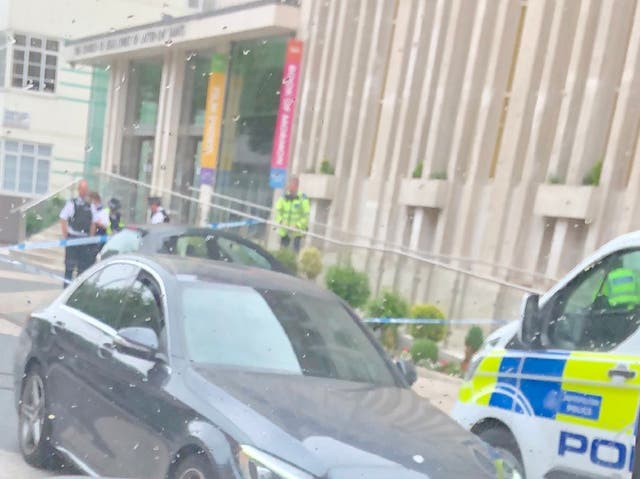 A police cordon in Sloane Square, central London, where two pedestrians were allegedly hit by a car, 3 June 2020.