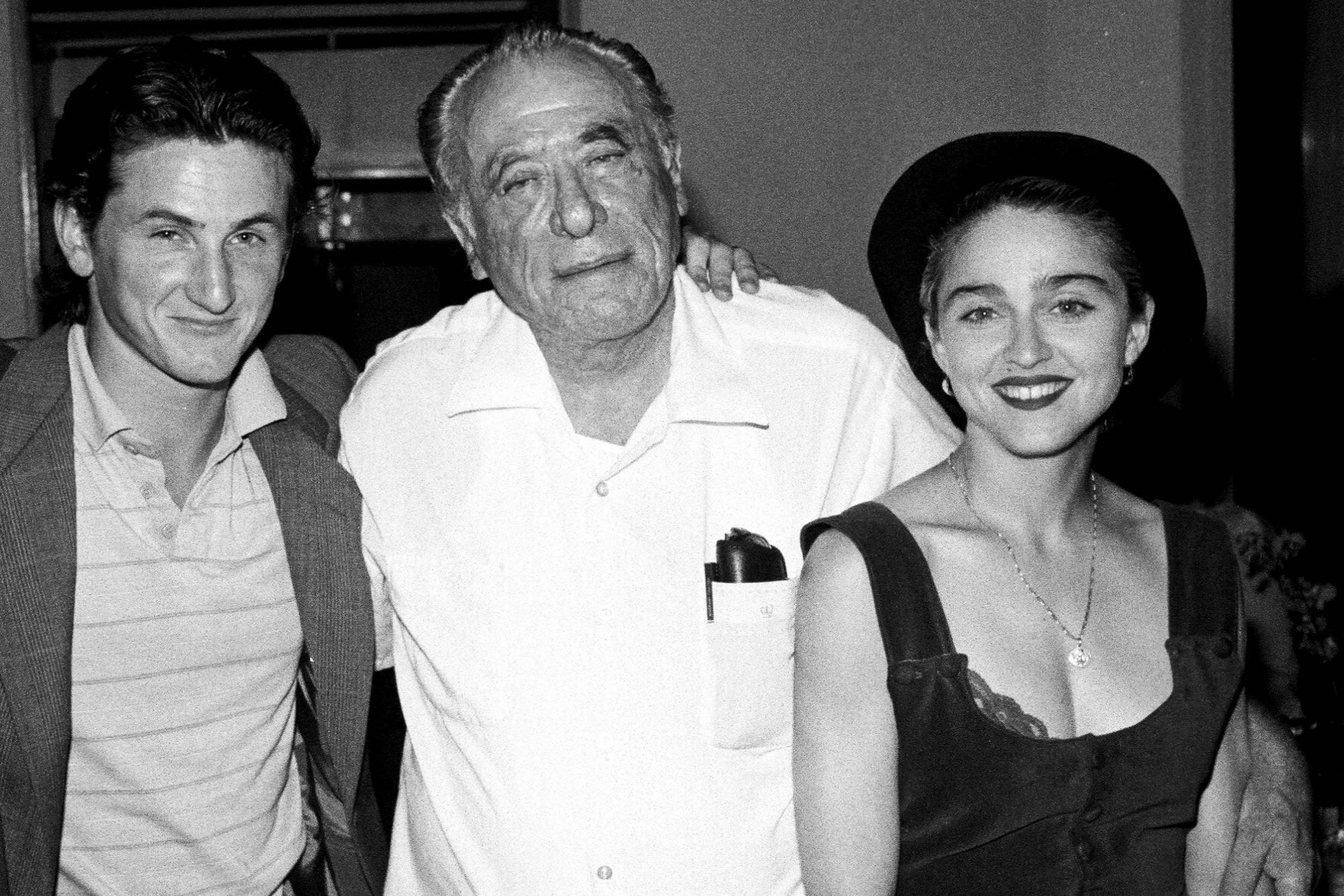 Bukowski with Sean Penn and Madonna at the party for the launch of his book ‘Love is a Dog From Hell’