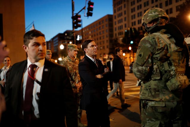 Defence Secretary Mark Esper (centre) visits DC National Guard military officers guarding the White House amid nationwide unrest following the death in Minneapolis police custody of George Floyd,