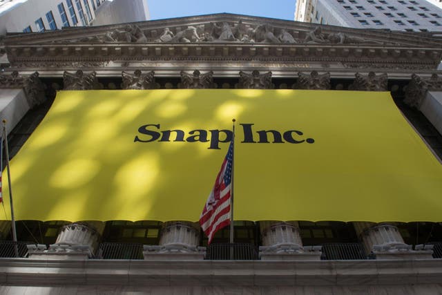 a Snap Inc. banner covers the facade of the New York Stock Exchange in New York, as the Snapchat IPO debuts