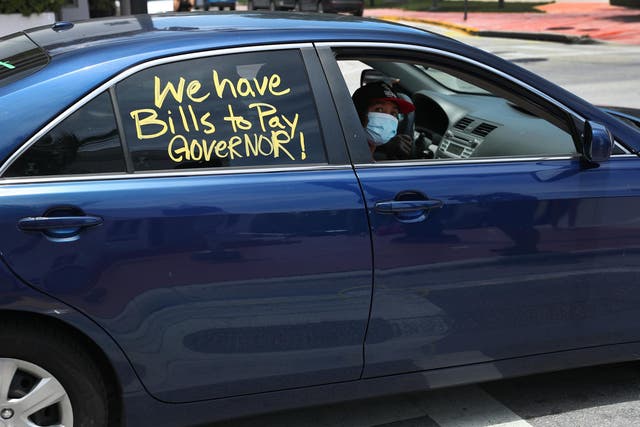 A vehicle is seen in a caravan protest asking the state of Florida to fix its unemployment system