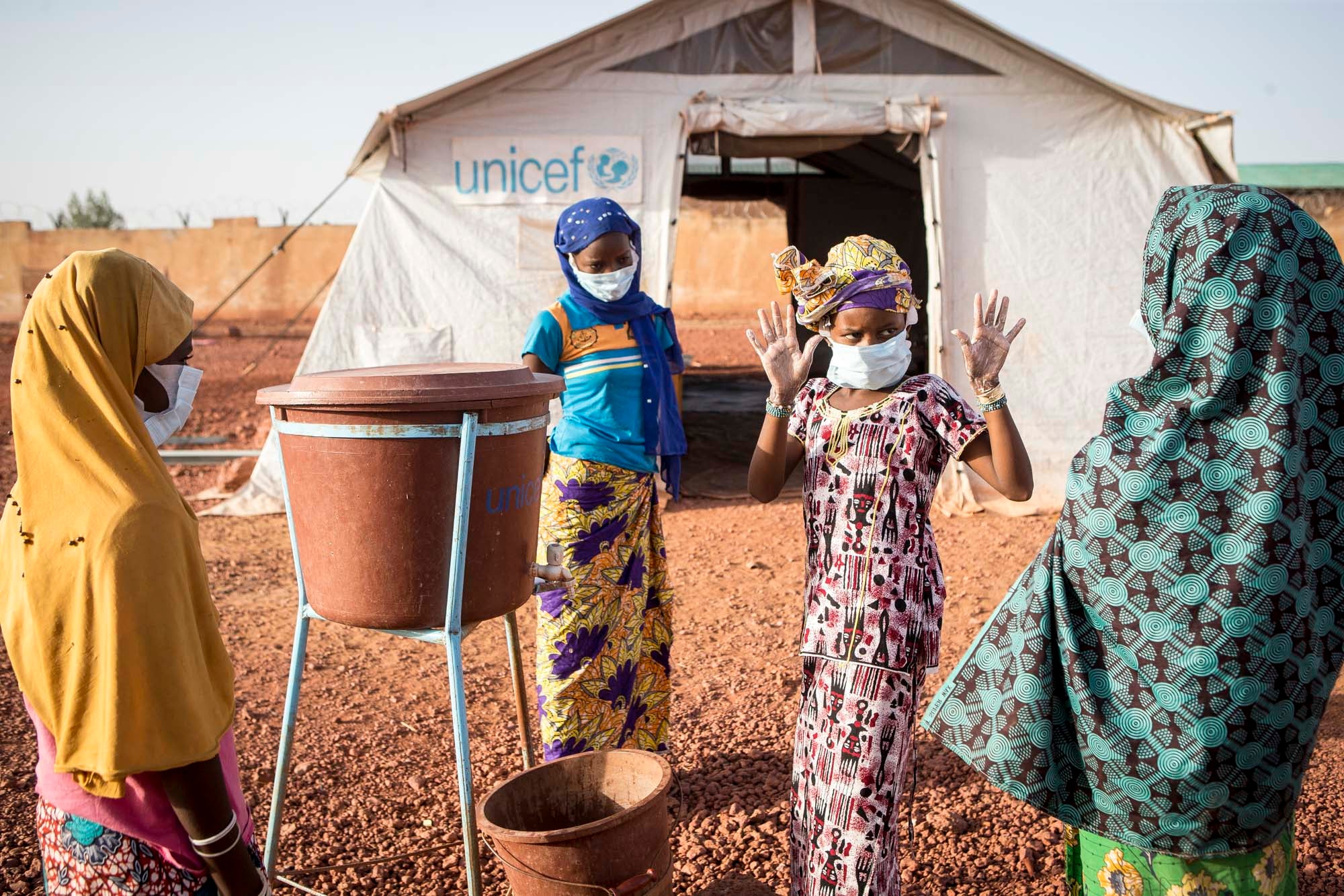 Hamsa is still recovering from her own trauma, but she volunteers in her camp to help others stave off coronavirus