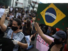 Pandemic ‘not over’ says WHO as Brazil reports record number of deaths