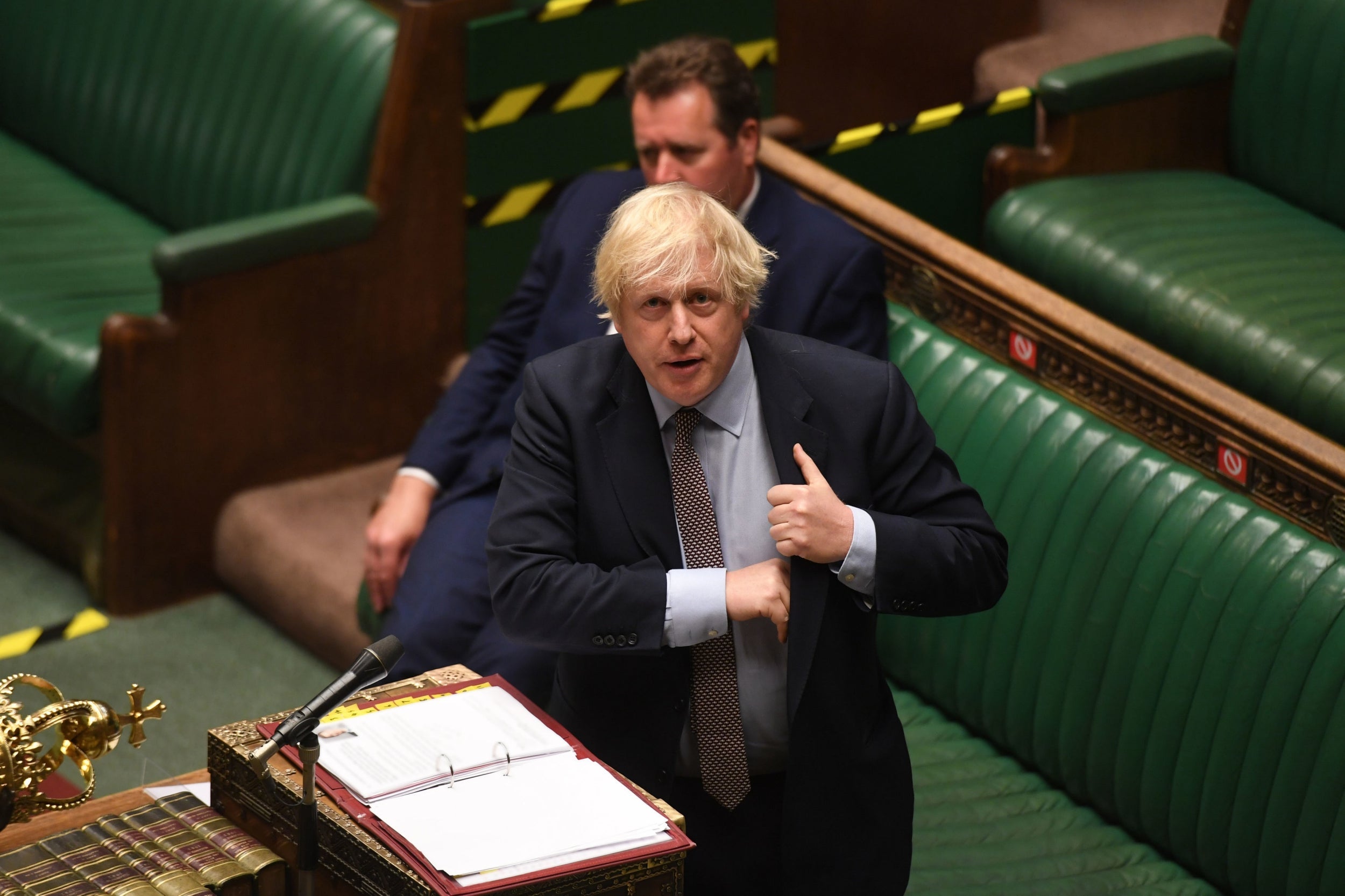 Boris Johnson has faced a backlash from MPs over the new travel restrictions