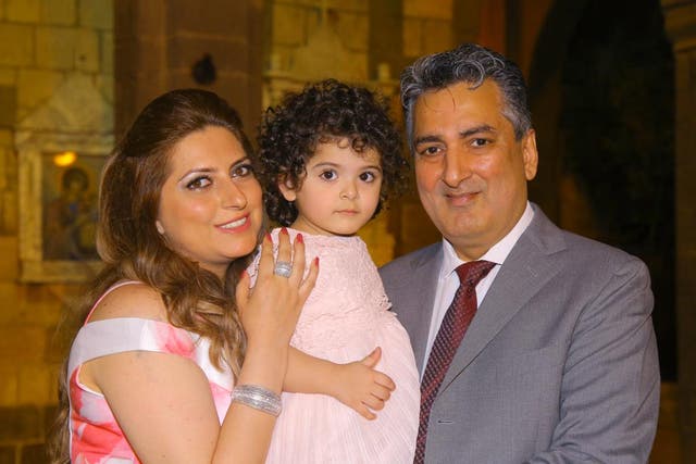 Ikram (right) says he feels he's being treated as a 'second-class citizen' as he toils in the NHS while being unable to have his wife Manal and young daughter Warda with him in the UK