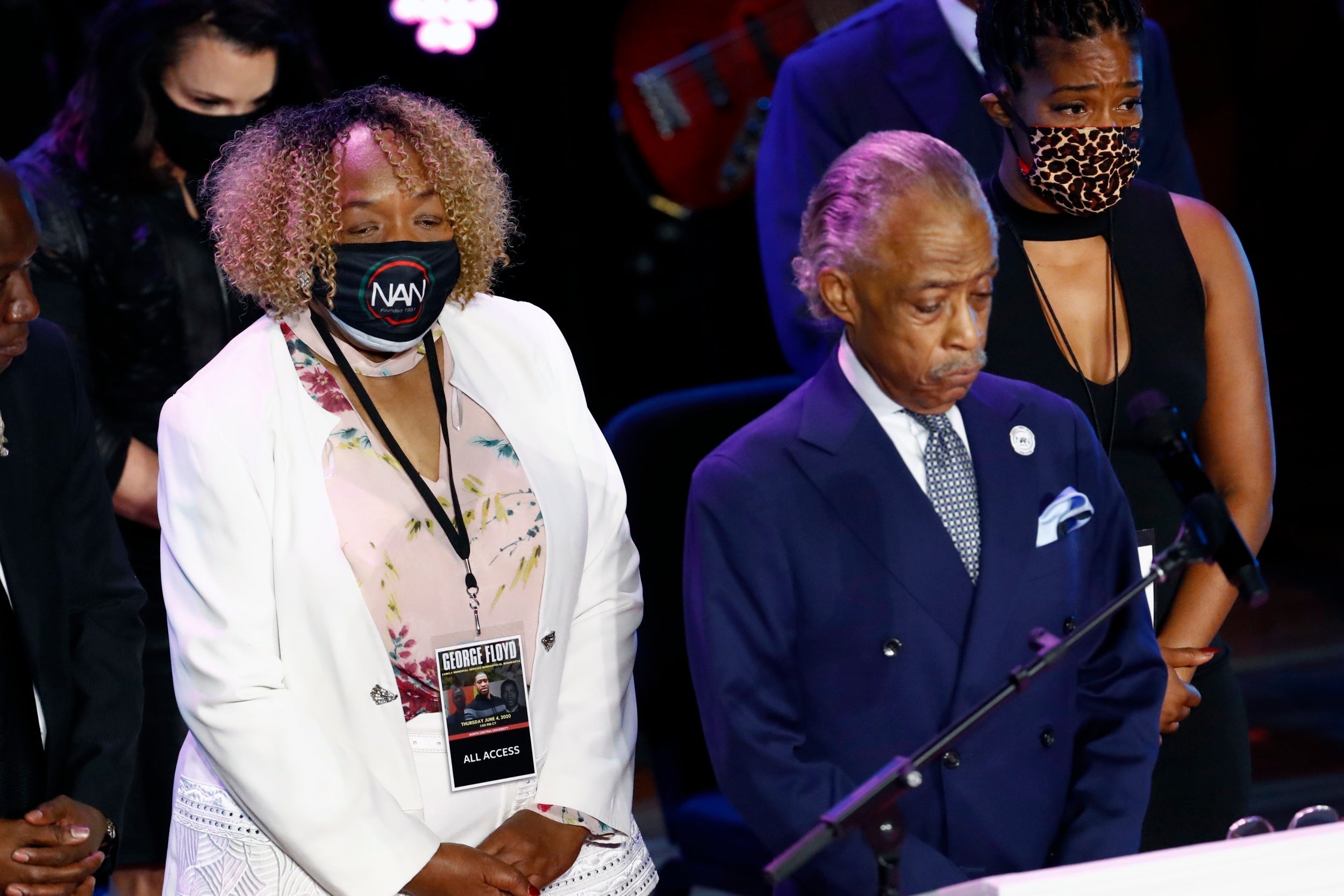 The Rev Al Sharpton at a memorial to George Floyd at North Central University in Minneapolis, flanked by Gwen Carr (left), the mother of Eric Garner, who was killed by police in New York City in 2014, and Tiffany Haddish (right)
