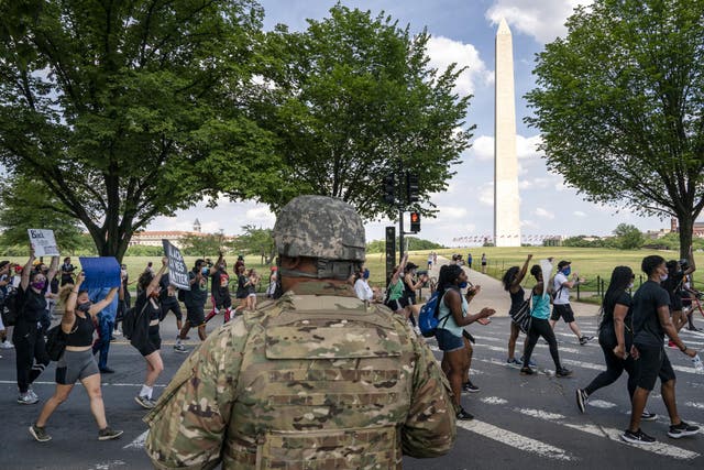 A US military officer oversees peaceful protest against police brutality from the White House to the Martin Luther King Jr memorial