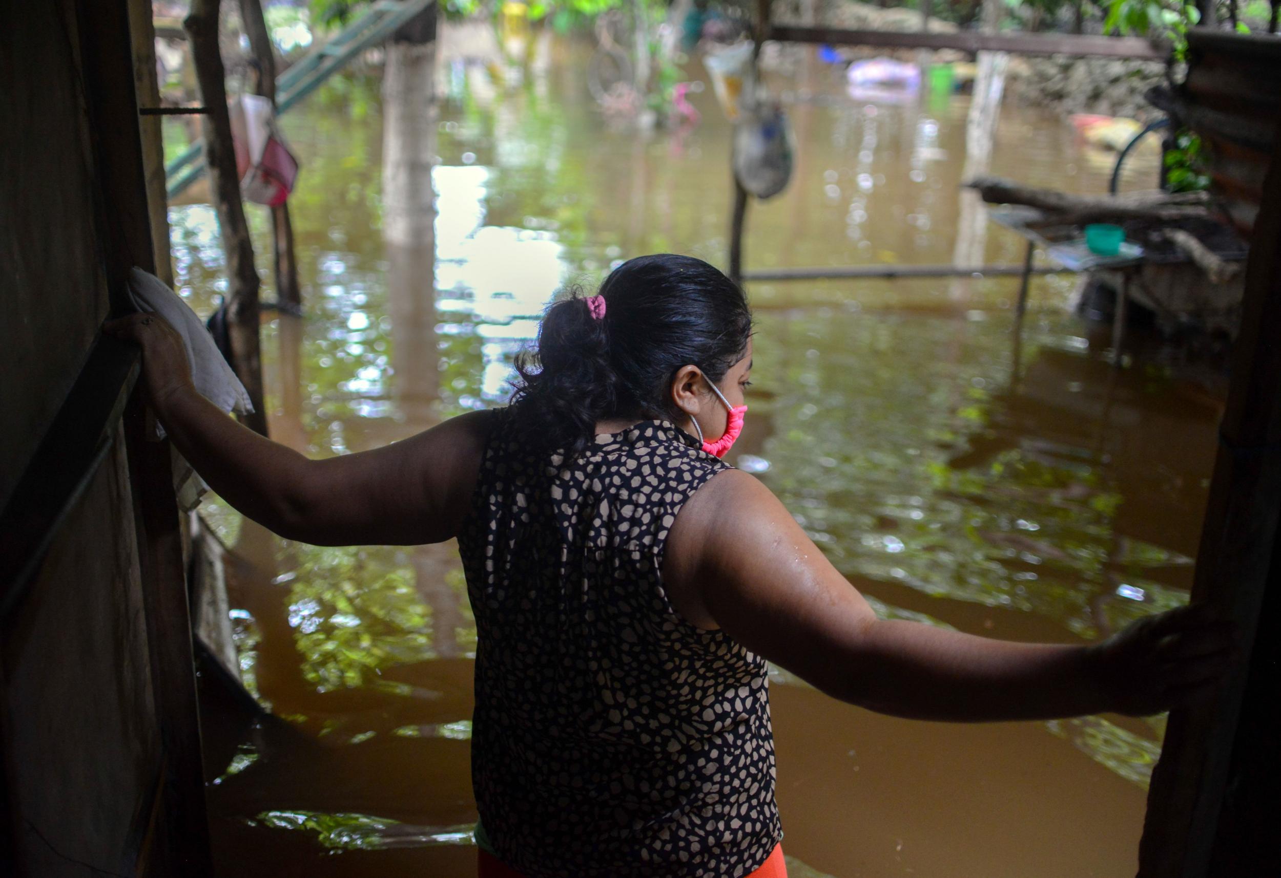 A woman from the Mayan community of Tecoh looks on during a flood caused by Tropical Storm Cristobal in the town of Tecoh in Mexico on 3 June.