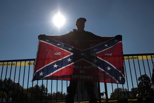 A man holds a Confederate flag during a 2017 protest in Virginia.