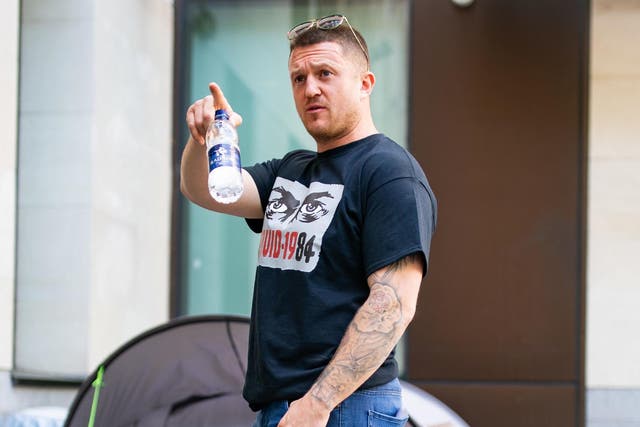 Tommy Robinson arrives at arrives at Westminster Magistrates' Court in London to support Britain First leader Paul Golding on 20 May, 2020.