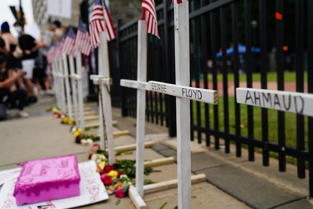 Crosses memorialising black men and women killed unjustly, including George Floyd, are seen outside Olympic Centennial Park in Atlanta, Georgia