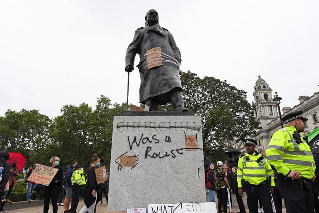 The graffiti was added to the statue in Parliament Square on Sunday