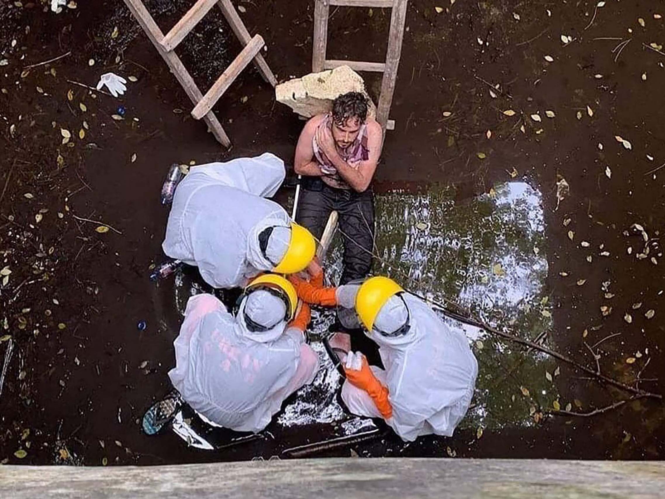 Members of an Indonesian search and rescue team save British national Jacob Roberts after he spent six days trapped in a well