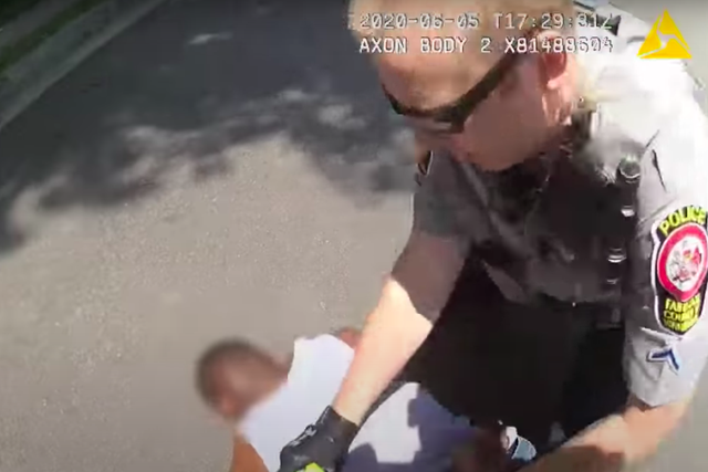 Police Officer Tyler Timberlake forcibly restrains an unarmed man after tasering him