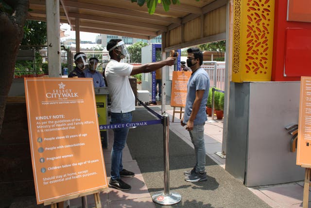Customers are required to go through several levels of disinfection, checks and contactless security measures before entering the Select Citywalk mall in Delhi