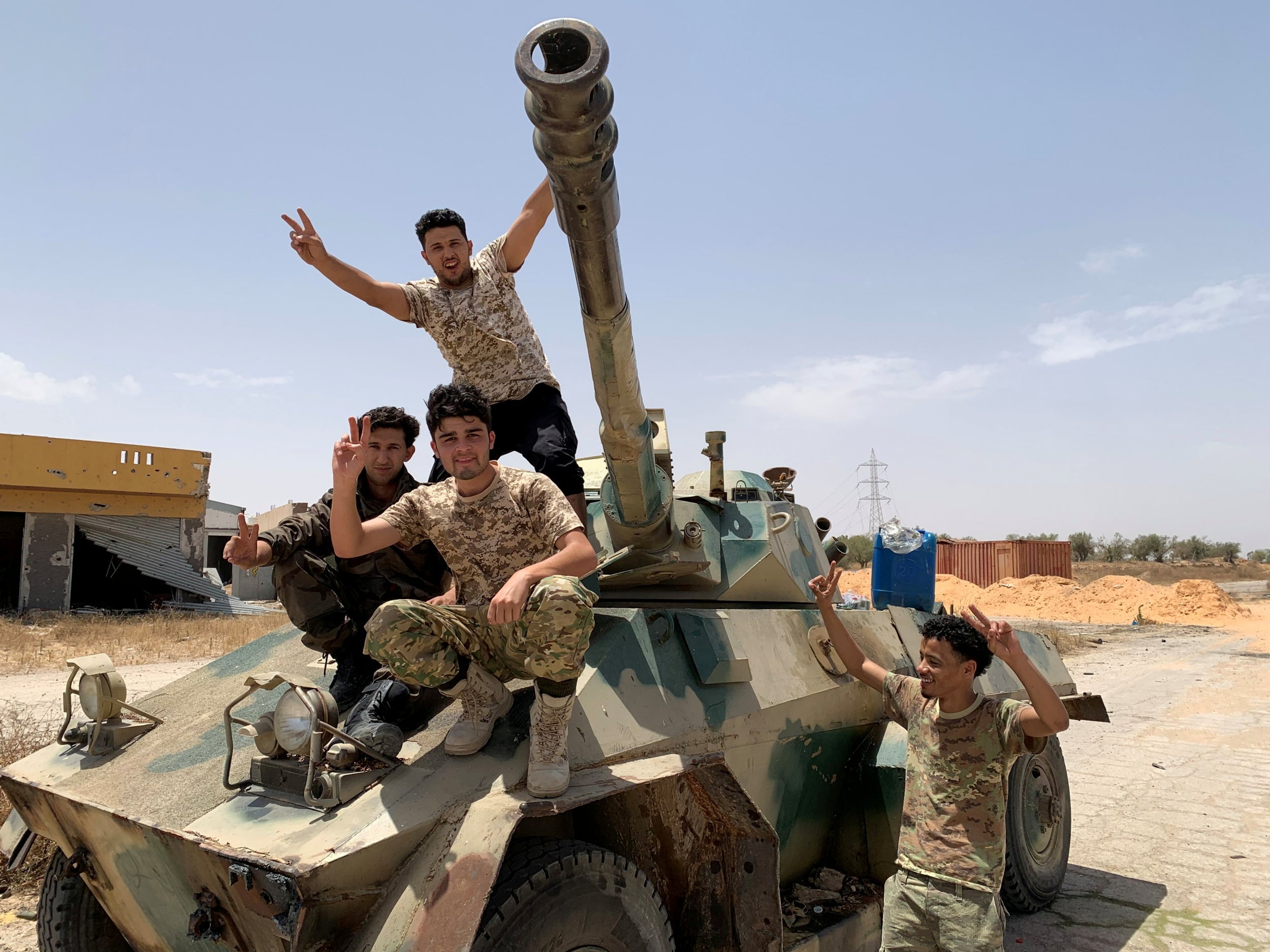 Fighters loyal to Libya’s internationally recognised government celebrate after regaining control of Tripoli