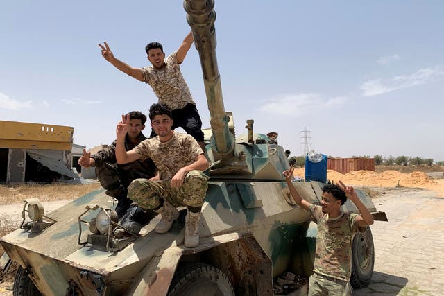 Fighters loyal to Libya’s internationally recognised government celebrate after regaining control of Tripoli