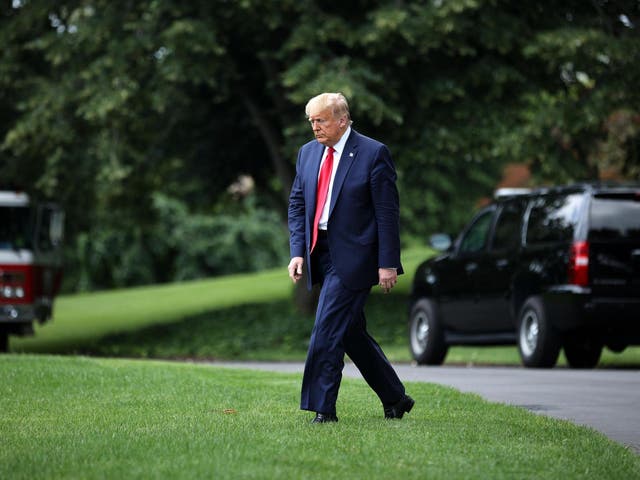 President Donald Trump walks across the South Lawn before boarding Marine One and departing the White House