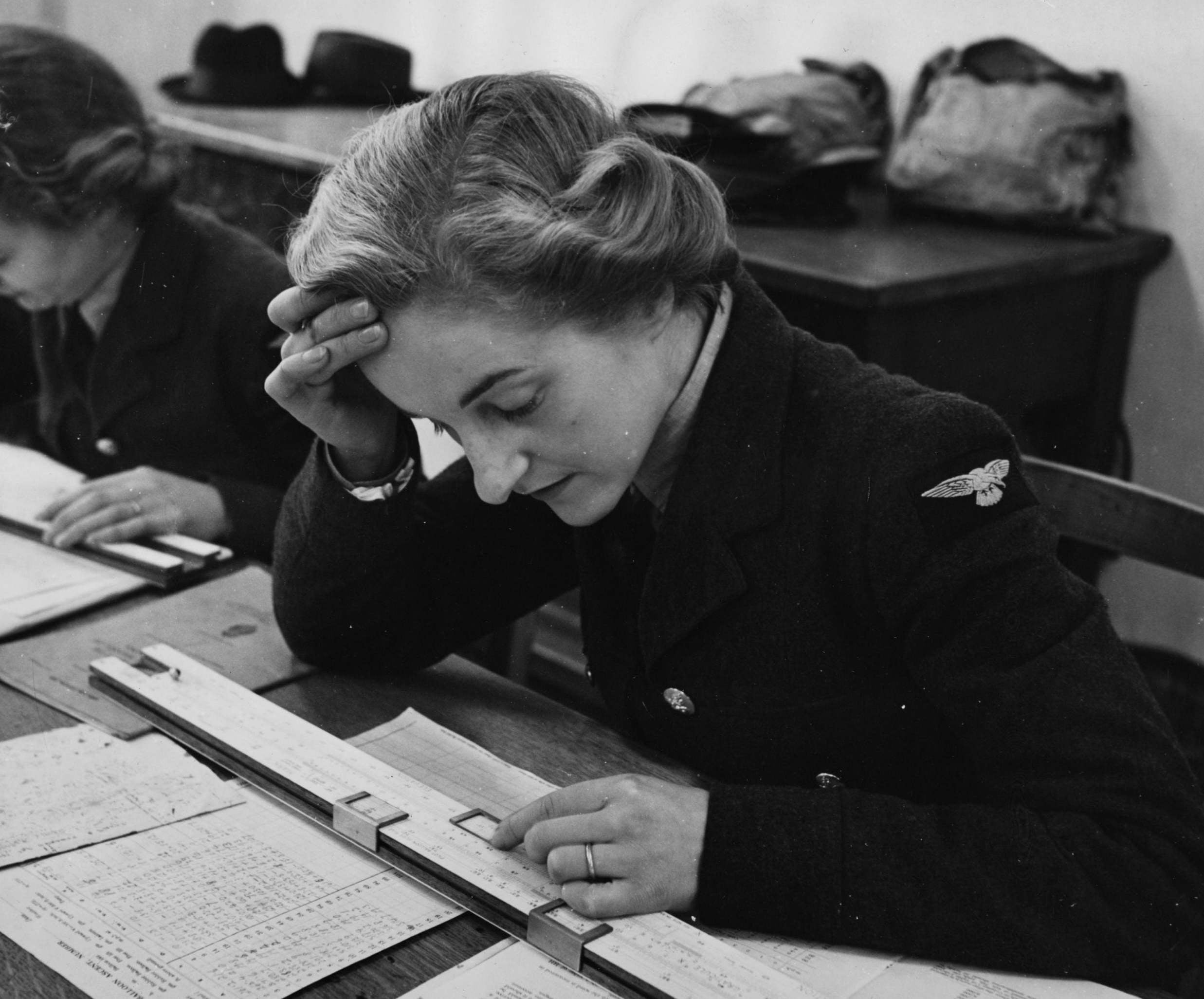 1941: a member of the Women’s Auxiliary Air Force uses a slide rule for mathematical calculations