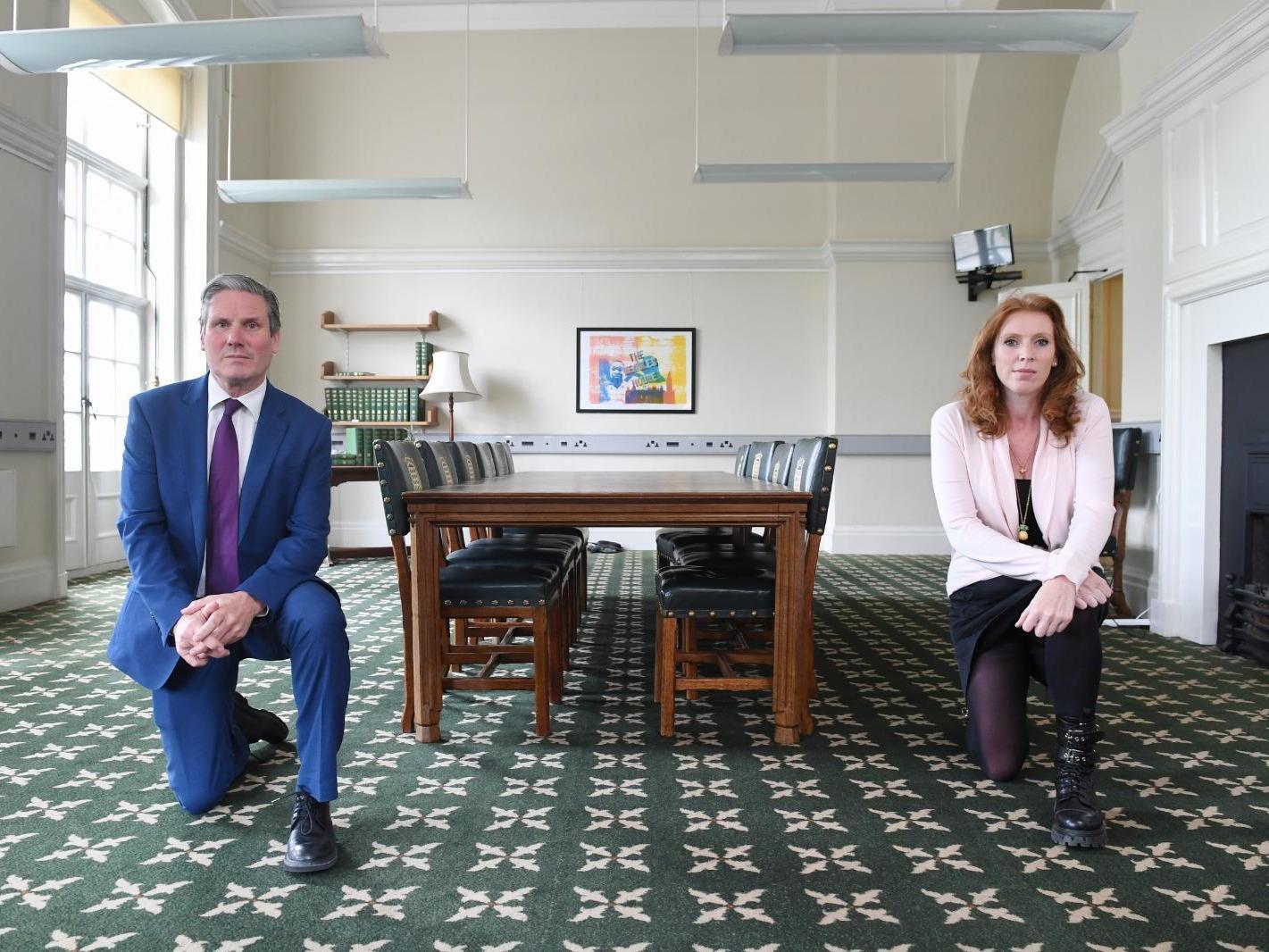 Sir Keir Starmer and deputy Labour leader Angela Rayner adopt the famous protest stance