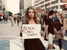 Influencer defends posing for photos at Black Lives Matter protest