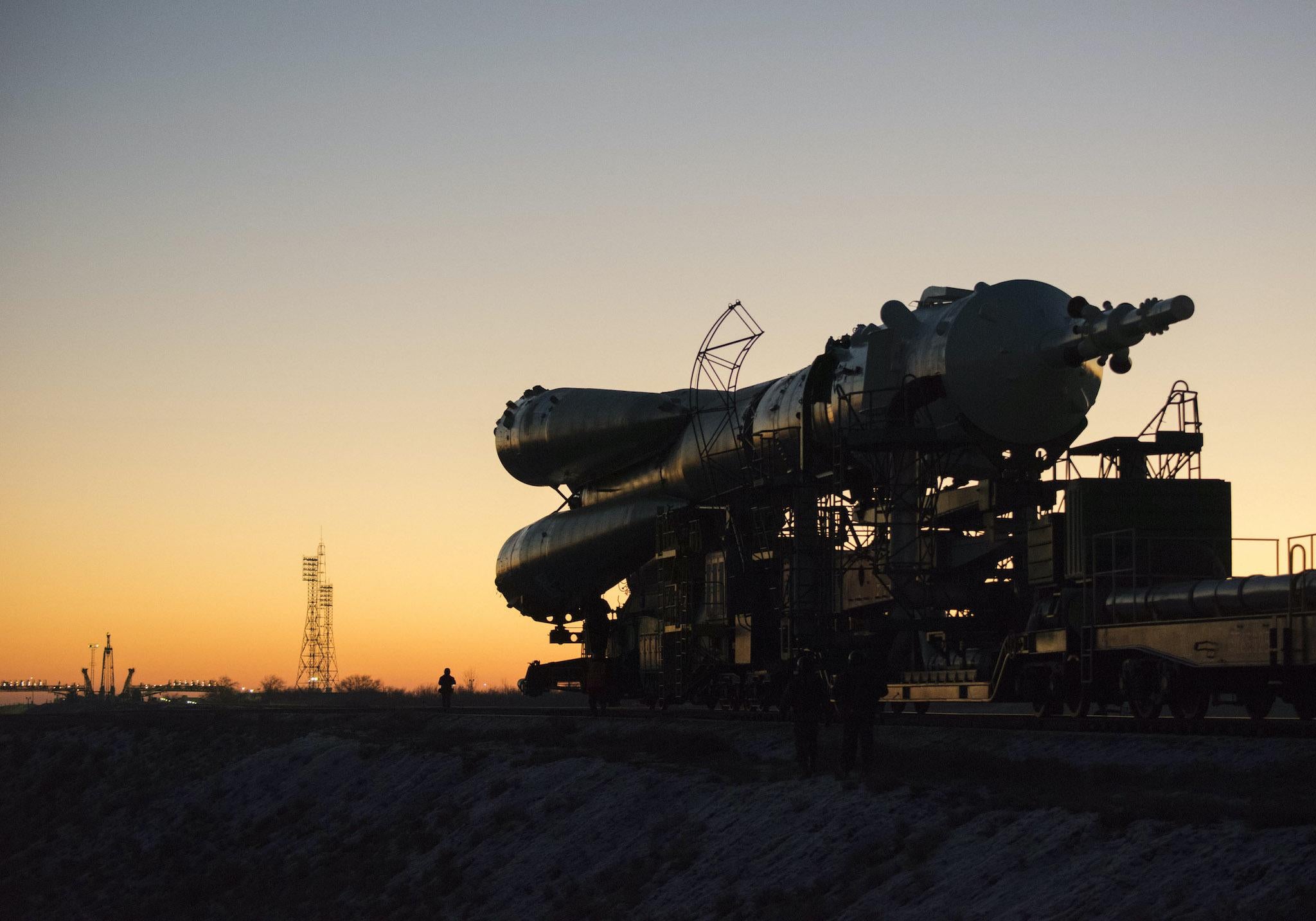 In this handout image supplied by the European Space Agency (ESA), The Soyuz TMA-19M spacecraft is rolled out by train from the MIK 112 integration facility to the Baikonur Cosmodrome launch pad 1