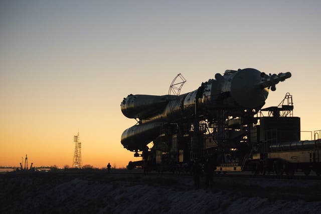 In this handout image supplied by the European Space Agency (ESA), The Soyuz TMA-19M spacecraft is rolled out by train from the MIK 112 integration facility to the Baikonur Cosmodrome launch pad 1
