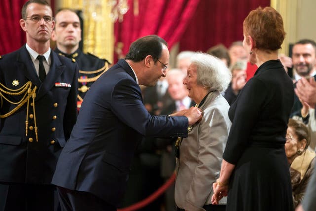 Francois Hollande awards Rol-Tanguy with the Legion of Honour medal in 2014 for her bravery during the Second World War