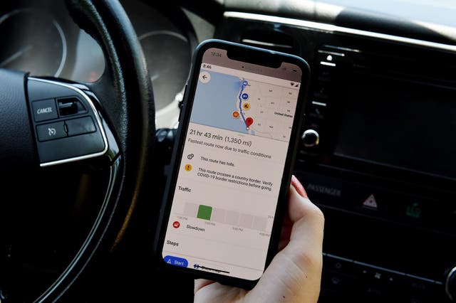 <p>This illustration picture shows Google map application displaying COVID-19 restrictions along your route on a smartphone in Arlington, Virginia on June 9, 2020</p>