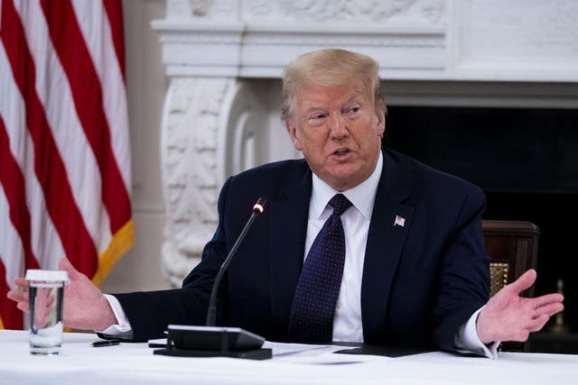 President Donald Trump makes remarks as he participates in a roundtable with law enforcement officials in the State Dining Room of the White House