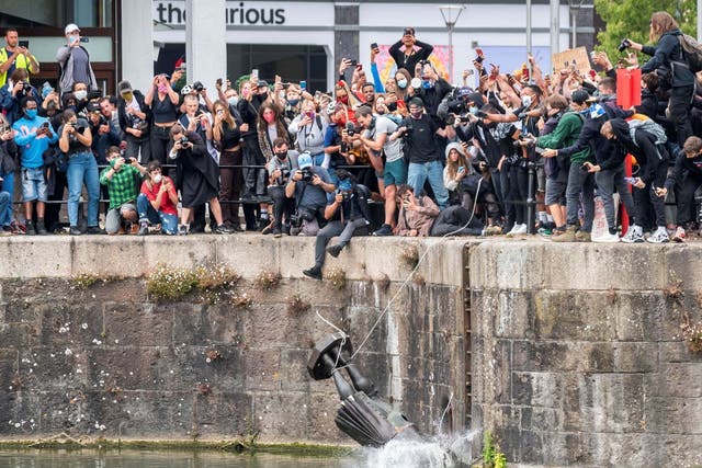 The statue is dumped into the Bristol Harbour on Sunday